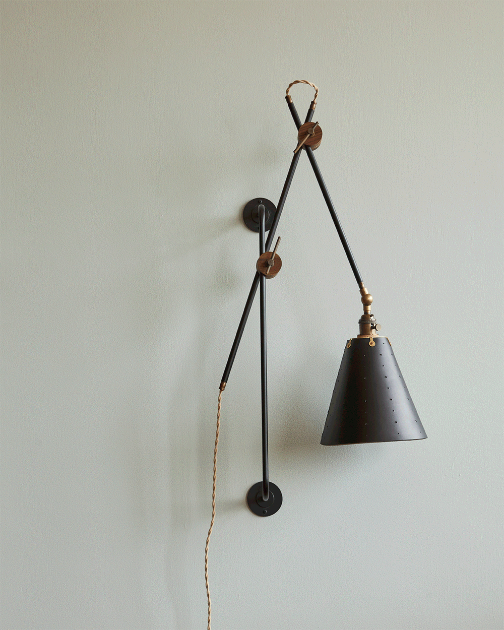 Large articulating black plug in wall sconce with black handstitched cone leather shade #shade-finish_black harness #wiring_plug-in