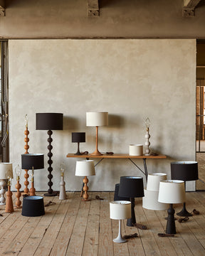 Collection of Lostine wood turned lamps in natural red oak, white wash, and dark wash finishes