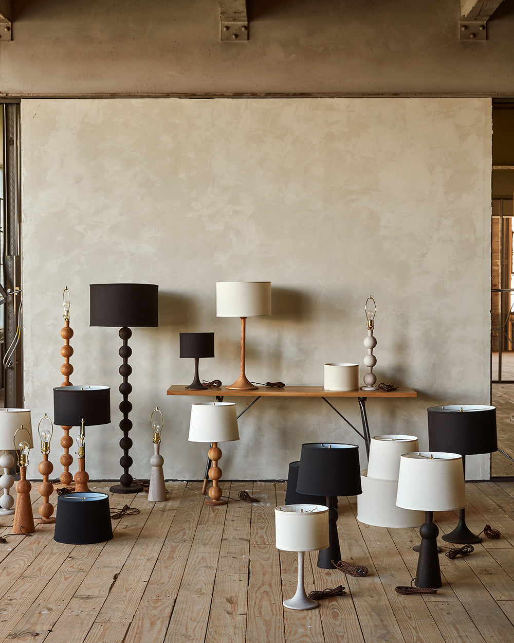 Collection of Lostine wood turned lamps in natural red oak, white wash, and dark wash finishes 