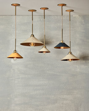 Leather and brass ceiling pendant light. Made by RTO Lighting in Philadelphia. Hardwired light fixture. Simple interior design, made in the USA.