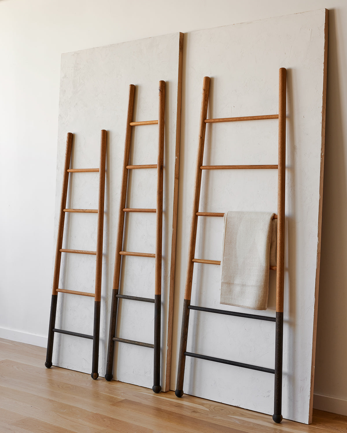Reclaimed white oak decorative ladder from Lostine. Simple interior design, made in the USA. Warm American Modern Design