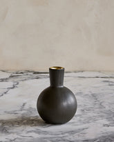 Round Bobbi ceramic candle holder in matte black glaze