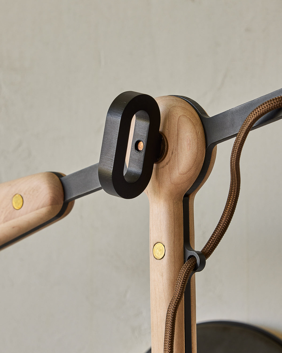 Maple, steel and ceramic wall sconce with articulating arm with stoneware shade and backplate #color_almost black