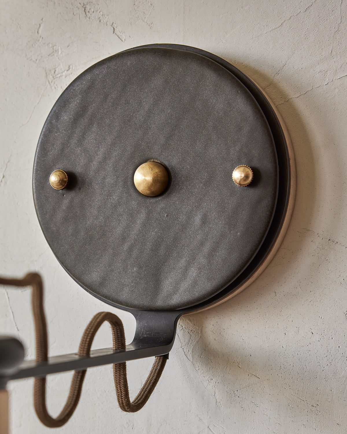 Maple, steel and ceramic wall sconce with articulating arm with matte black stoneware shade and  backplate #color_almost black
