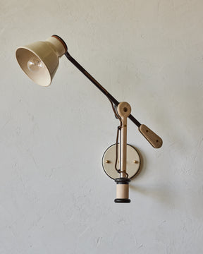Maple, steel and ceramic wall sconce with articulating arm with glossy white stoneware shade