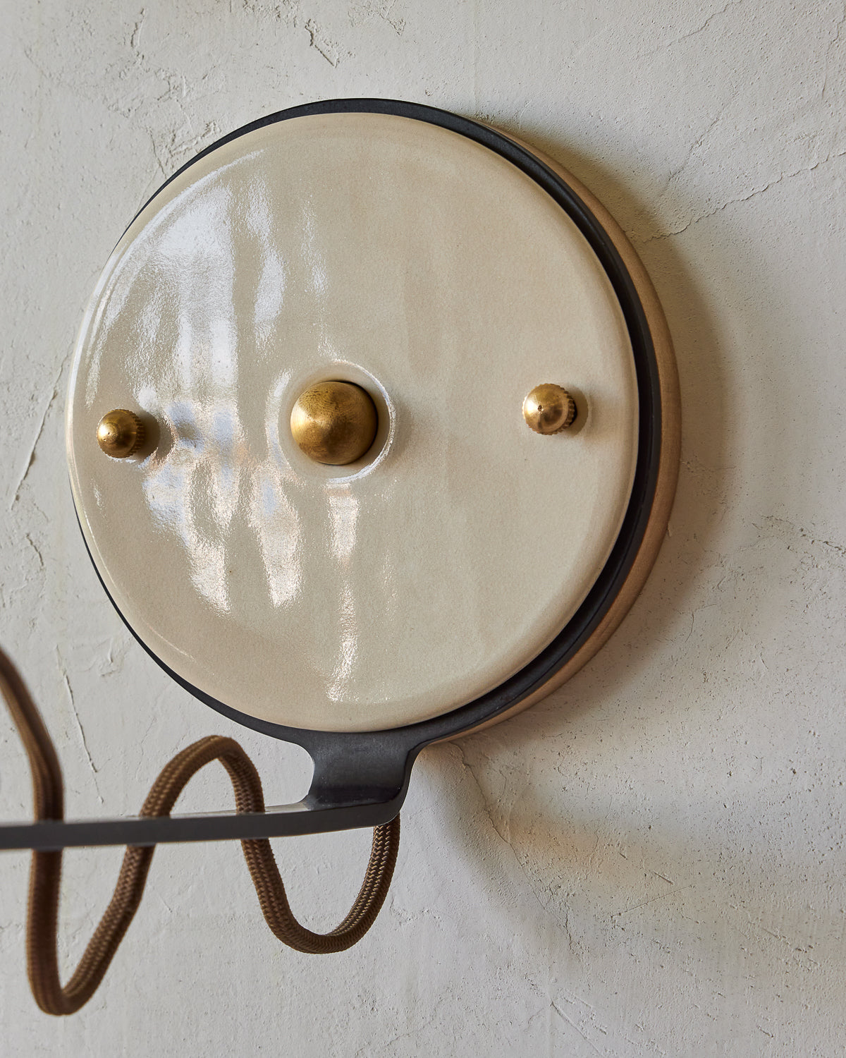 Maple, steel and ceramic wall sconce with articulating arm with glossy white stoneware shade and backplate #color_cream