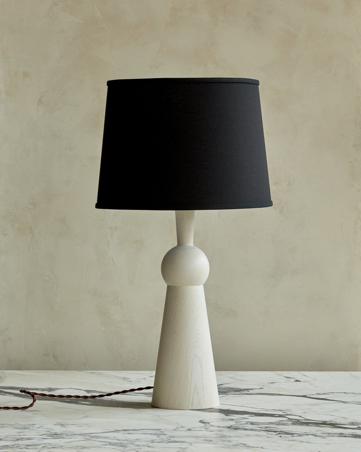 White wash solid wood table lamp with gently tapered body and black linen  shade #wood-finish_white wash red oak #shade-color_black linen