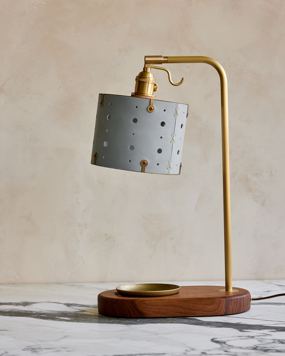 Charming desk lamp with blue handstitched articulating leather shade, warm brass and walnut wood with brass dish