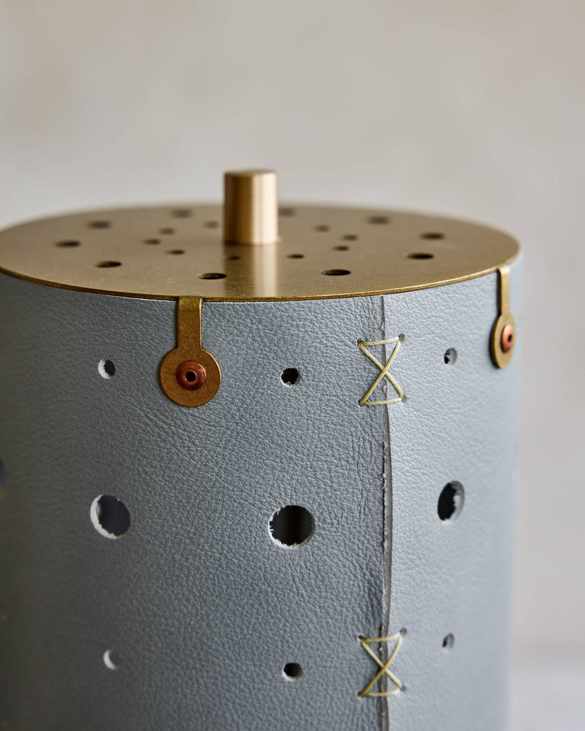 Charming accent lamp with blue handstitched leather shade, warm brass and walnut wood