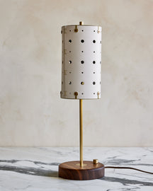 Charming accent lamp with white handstitched leather shade, warm brass and walnut wood