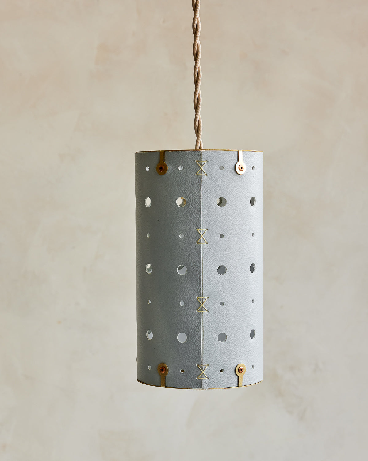 Charming leather pendant light with blue handstitched shade and brass accents  #color_cloud blue