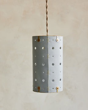 Charming leather pendant light with blue handstitched shade and brass accents