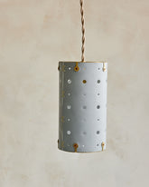 Charming leather pendant light with blue handstitched shade and brass accents