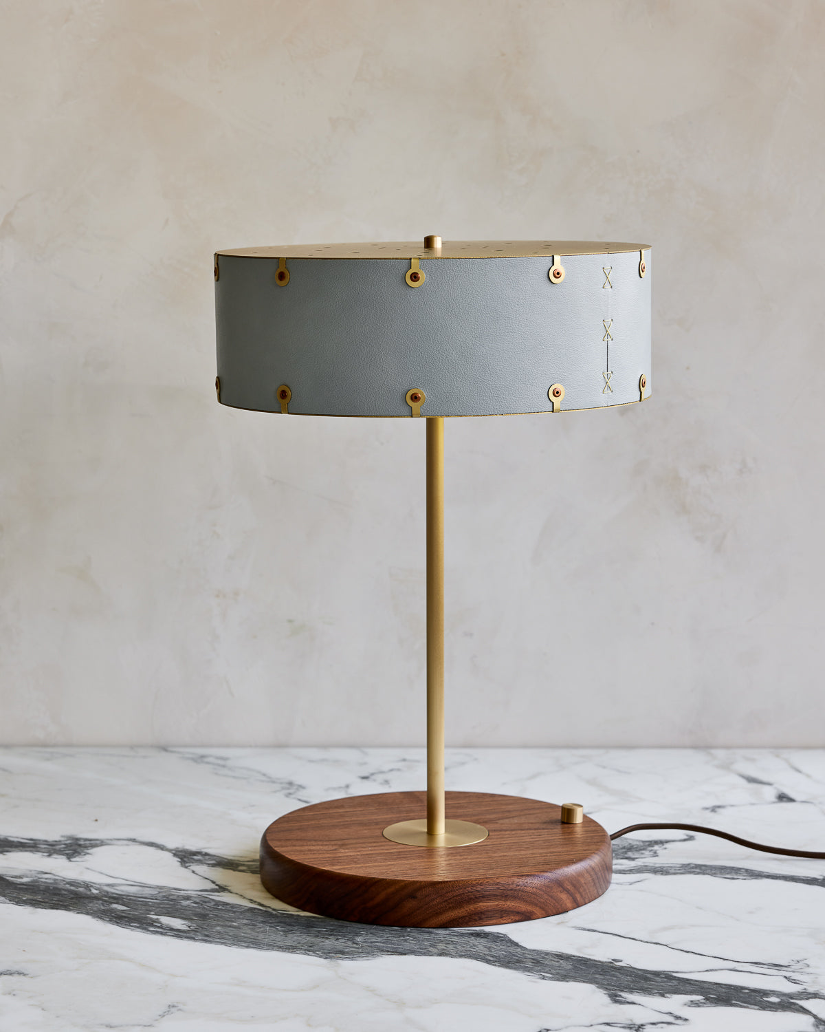 Brass table lamp with walnut base and blue leather shade
