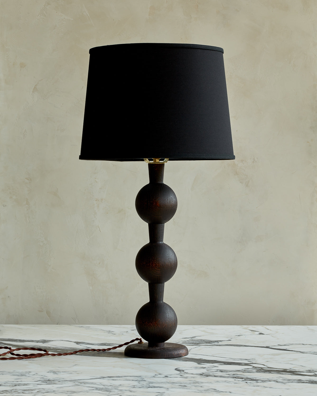 Sculptural solid wood table lamp with barbell design in dark wash finish with black linen shade #wood-finish_dark wash red oak #shade-color_black linen