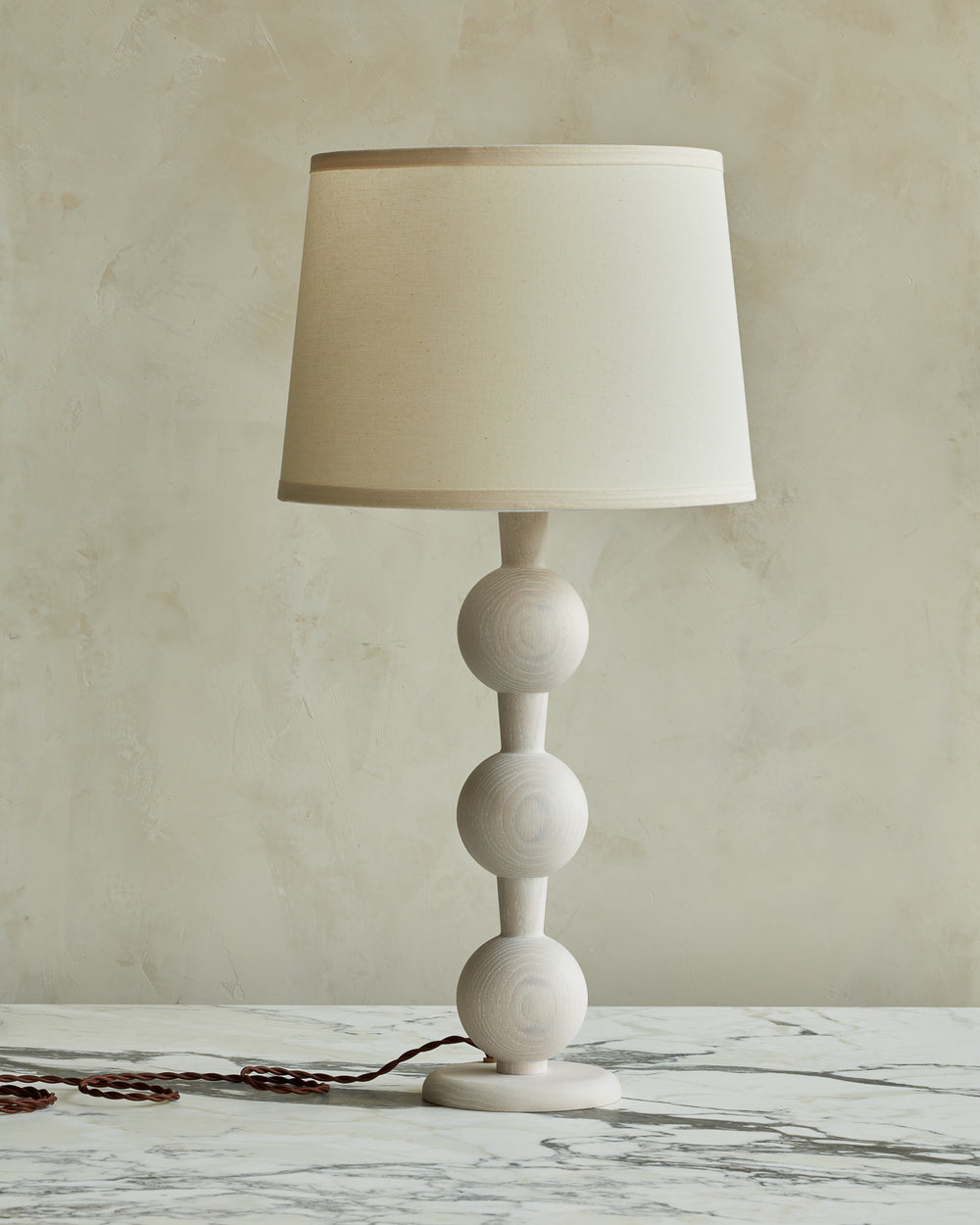 Sculptural solid wood table lamp with barbell design in white wash finish with ivory linen shade #wood-finish_white wash red oak #shade-color_ivory linen
