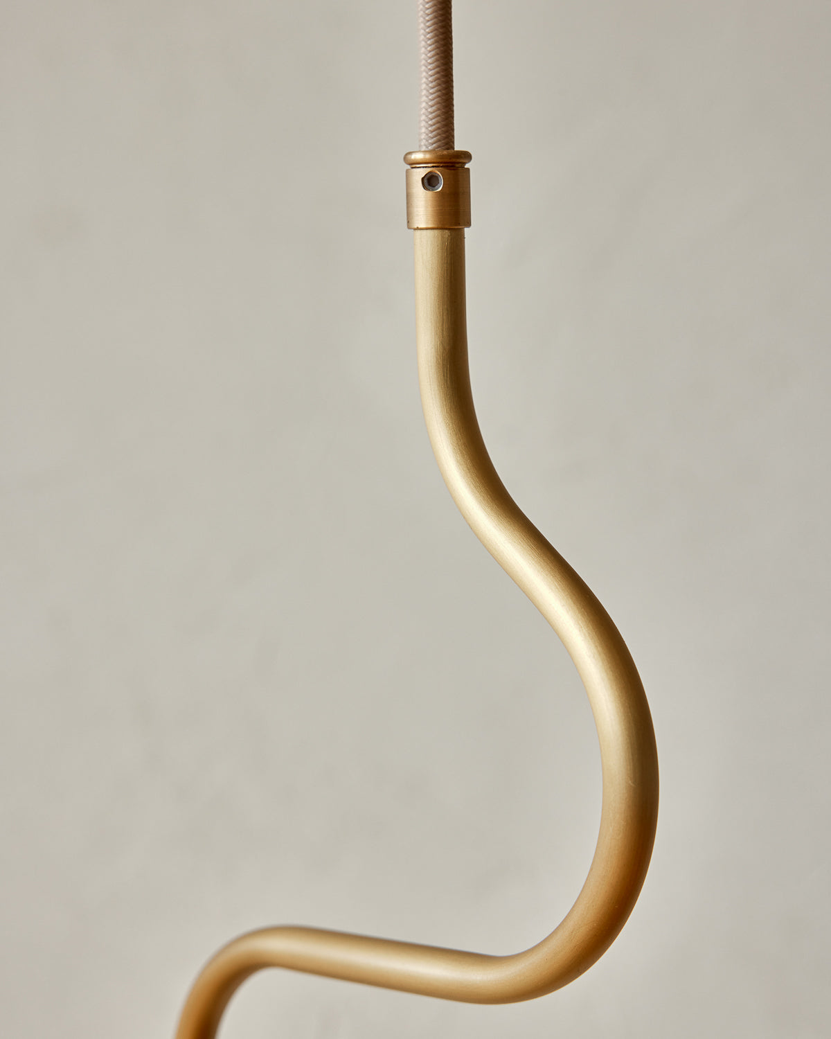 Modern brass globe pendant light with warm satin brass curved body and white milk glass globe #metal-finish_satin brass 