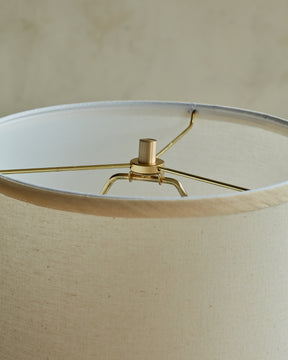 Brass accents with ivory linen shade