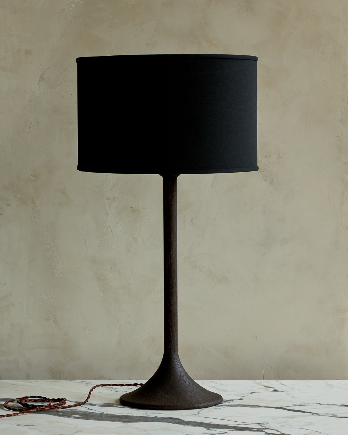 Large Trumpet table lamp with dark wash finish and black drum shade