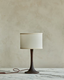 Small Trumpet table lamp with dark wash finish and ivory drum shade