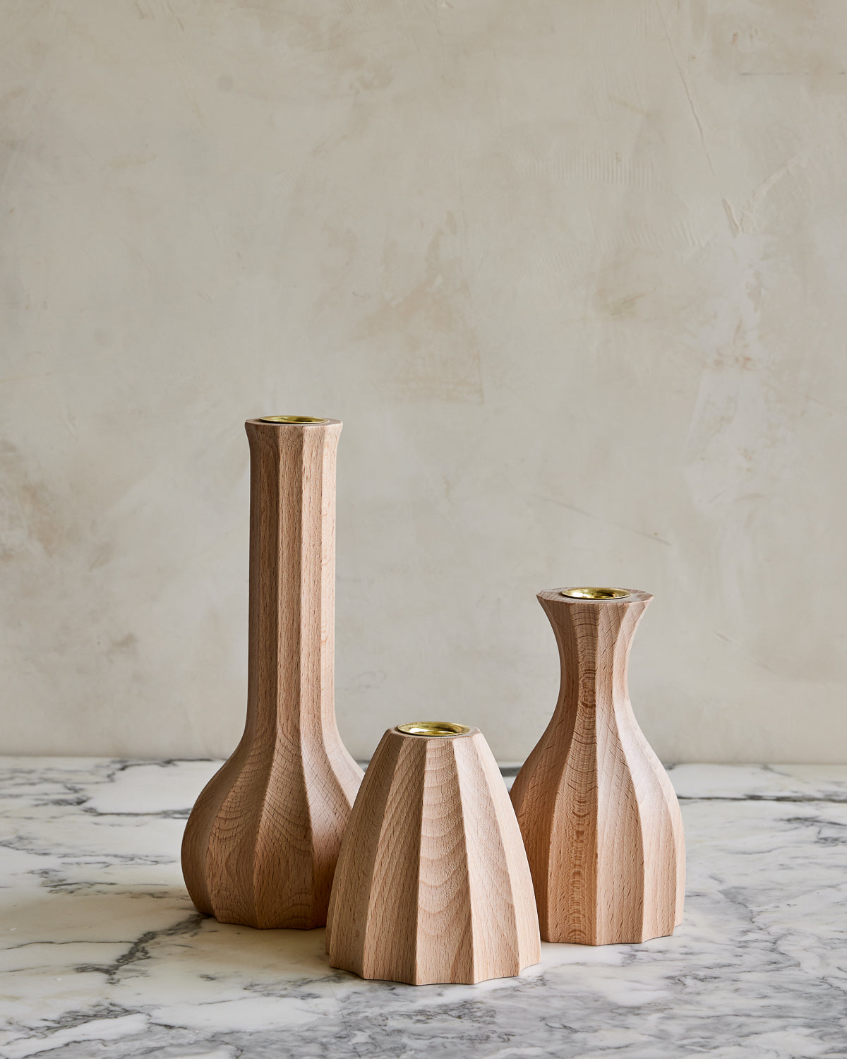 Trio of natural maple wooden candle holders with delicate grooves