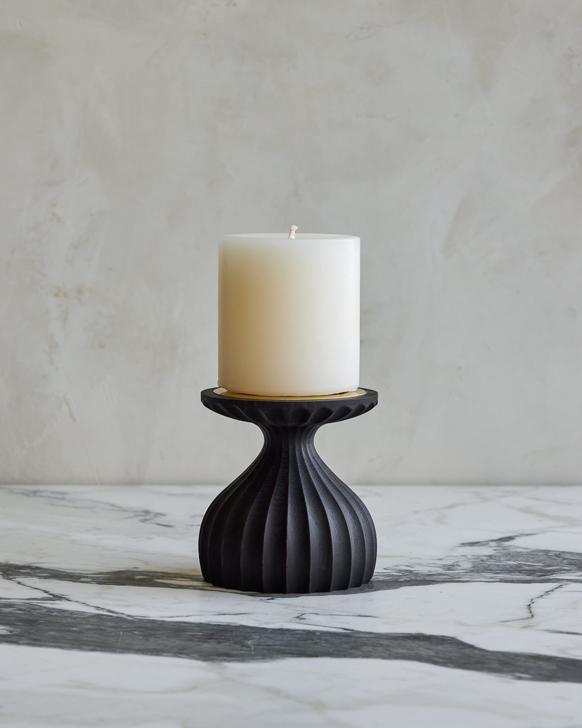 Short grooved dark wash maple wooden pillar candle holder with brass accents with white pillar candle
