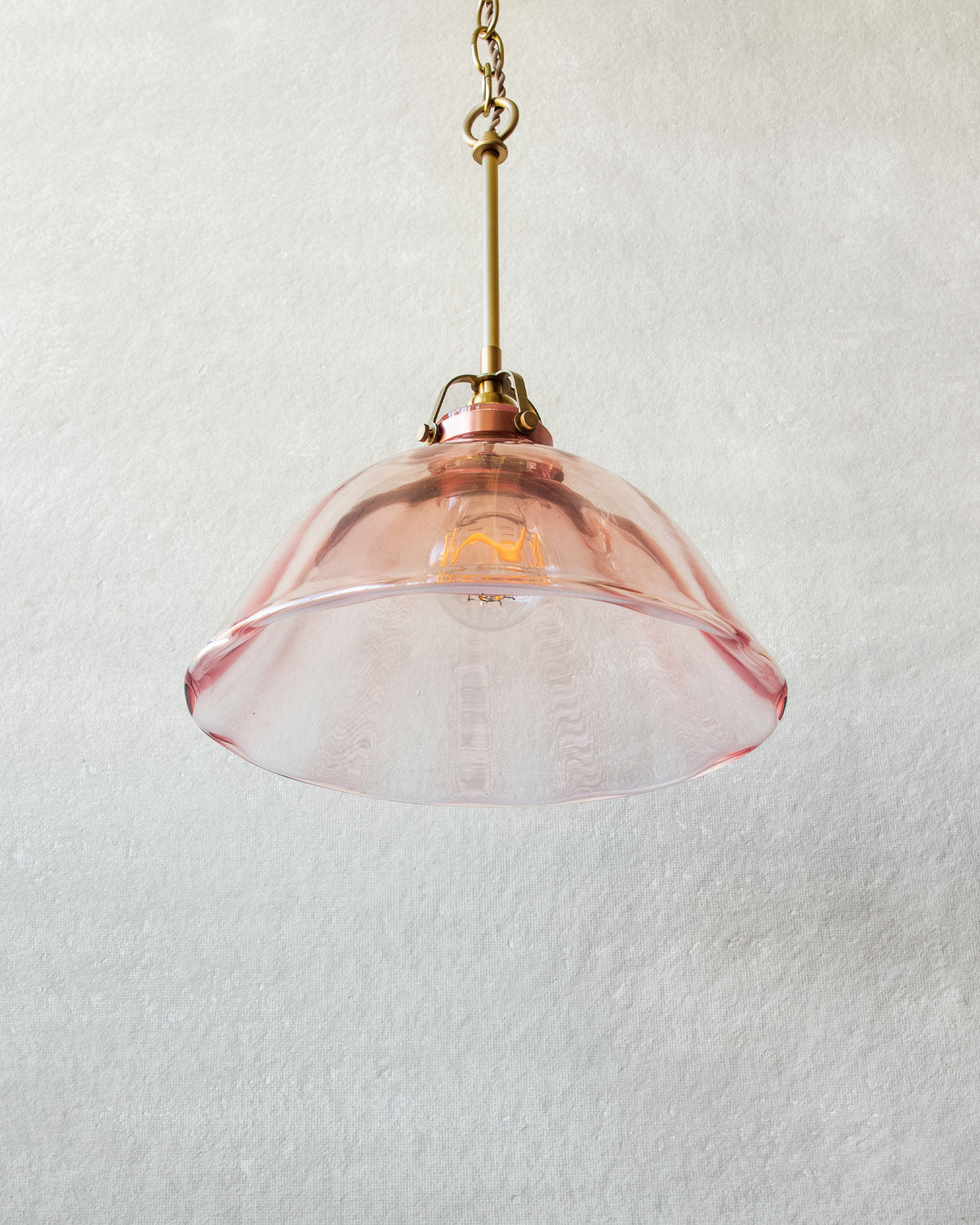 Rose Glass Pendant Light with satin brass cord set and chain.  Made by Lostine in Philadelphia. Hardwired fixture. Simple interior design, made in the USA.