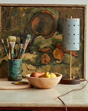 Charming accent lamp with blue leather, warm brass and walnut wood