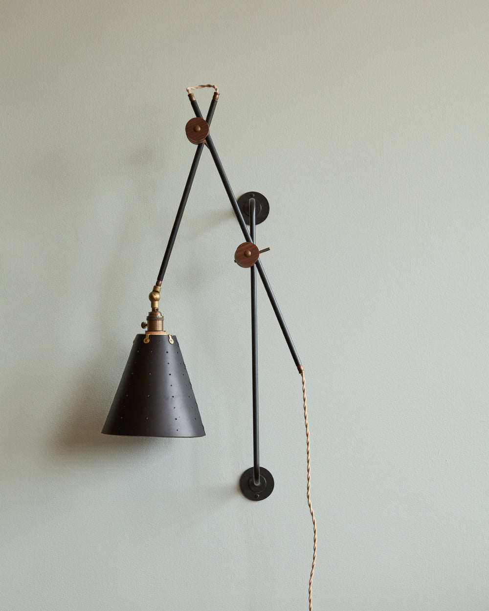 Large articulating black plug in wall sconce with black handstitched cone leather shade #shade-finish_black harness #wiring_plug-in