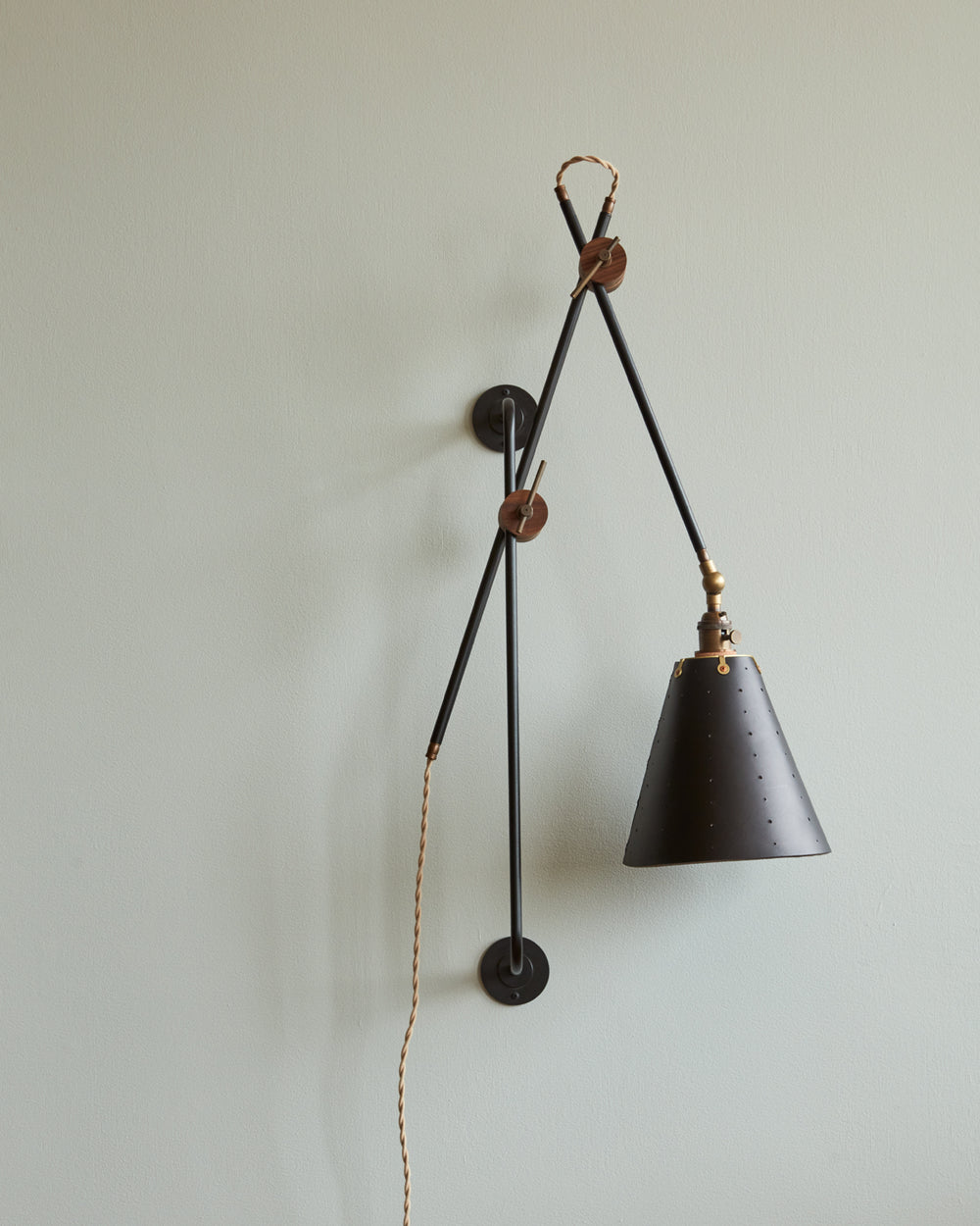 Large articulating black plug in wall sconce with black handstitched cone leather shade #shade-finish_black harness #wiring_plug-in