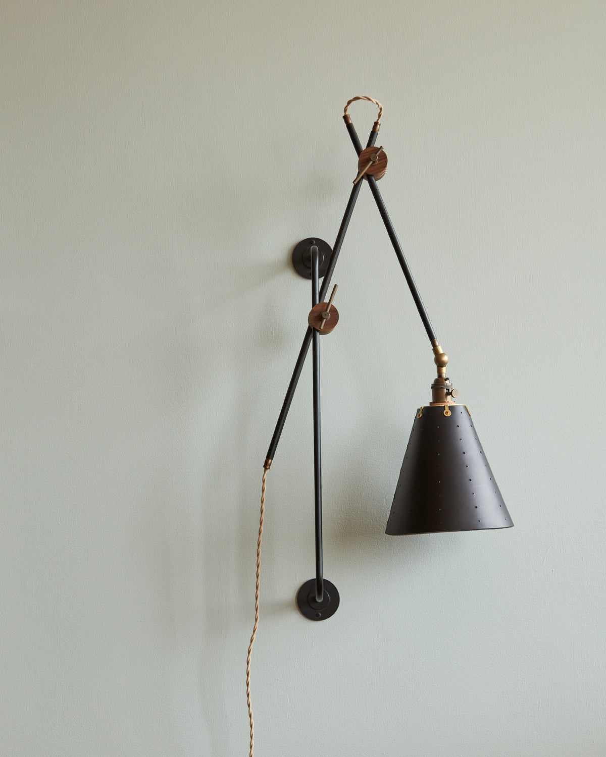 Large articulating black plug in wall sconce with black handstitched cone leather shade