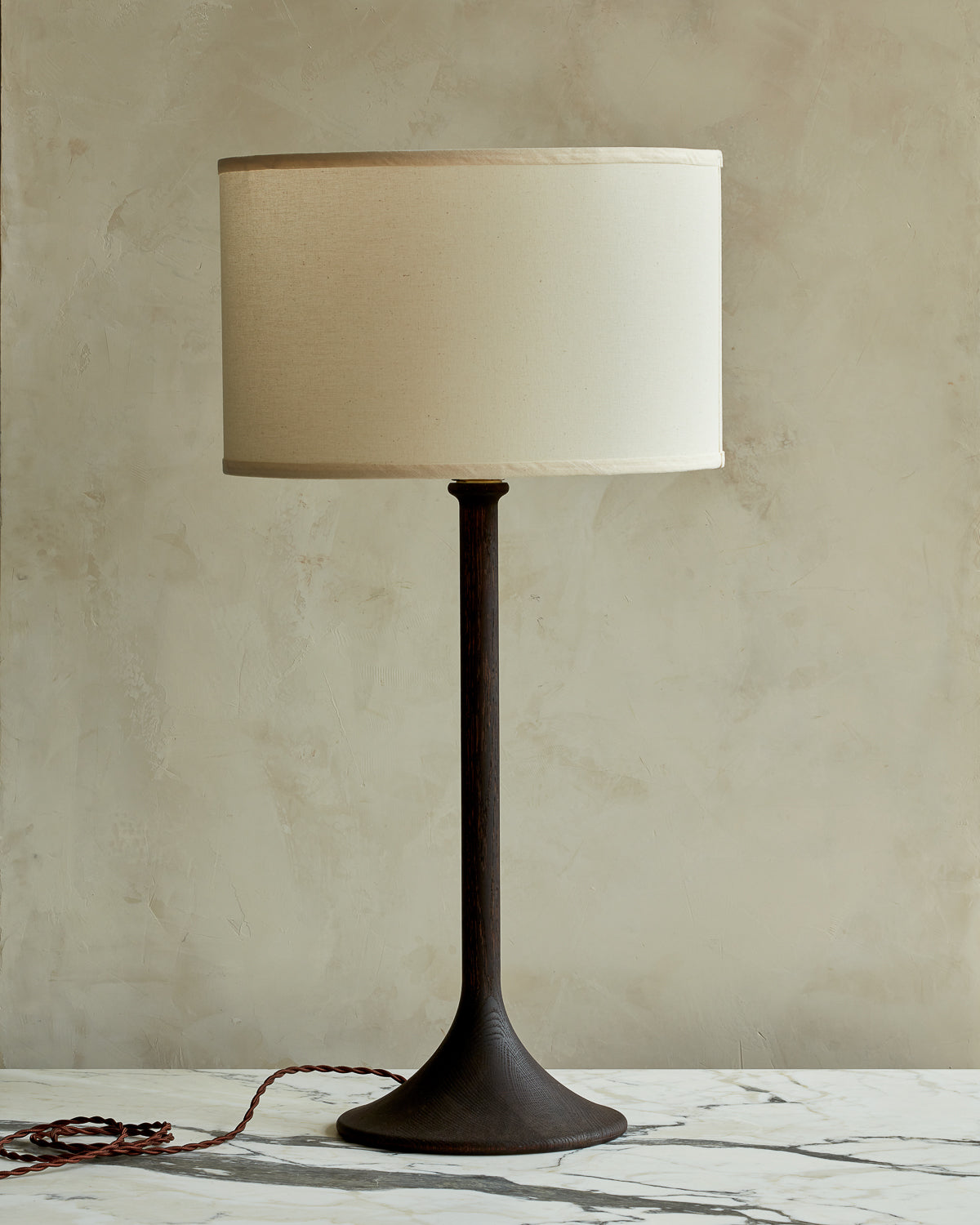 Large Trumpet table lamp with dark wash finish and ivory drum shade