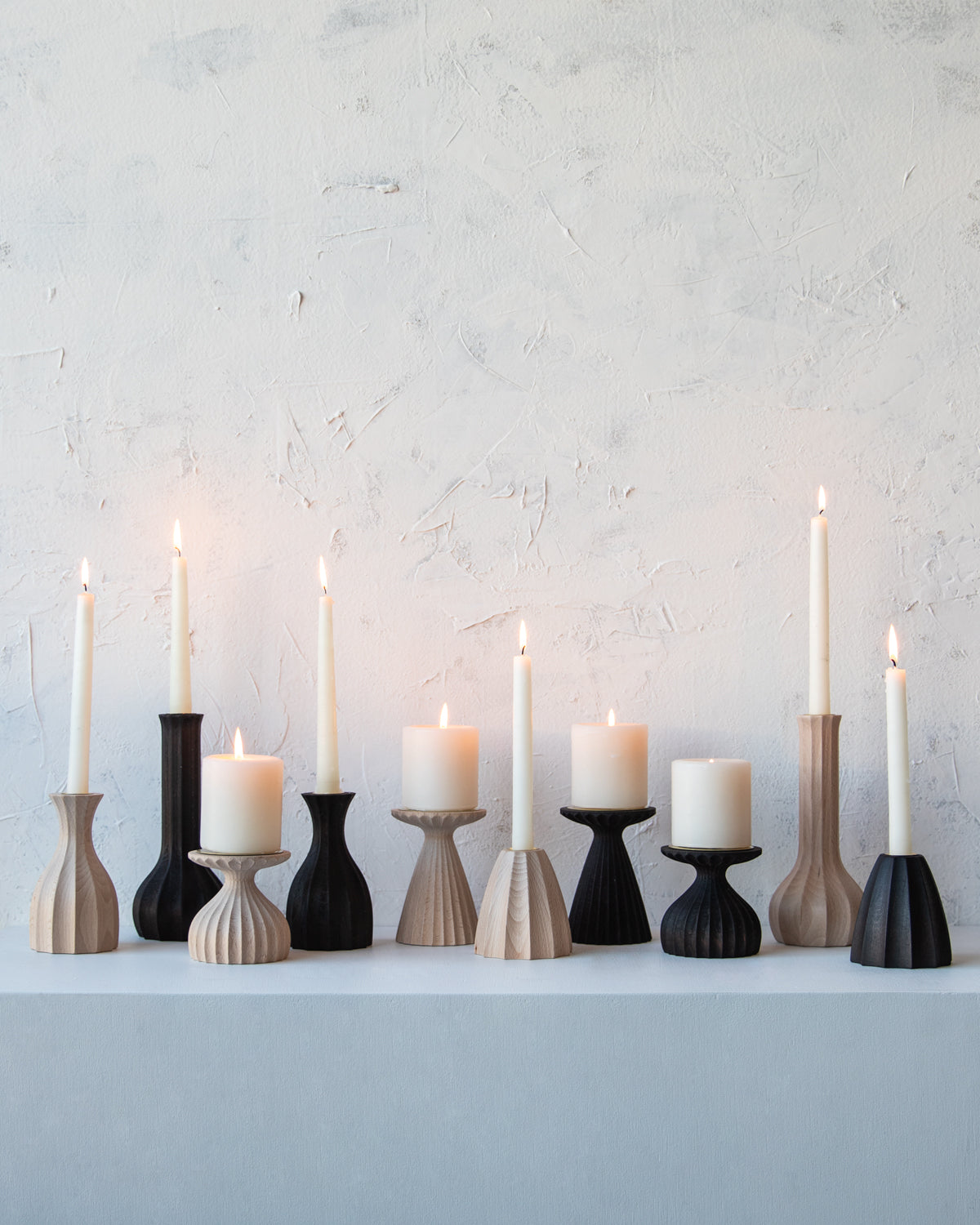 Collection of natural maple and dark wash maple candle holders