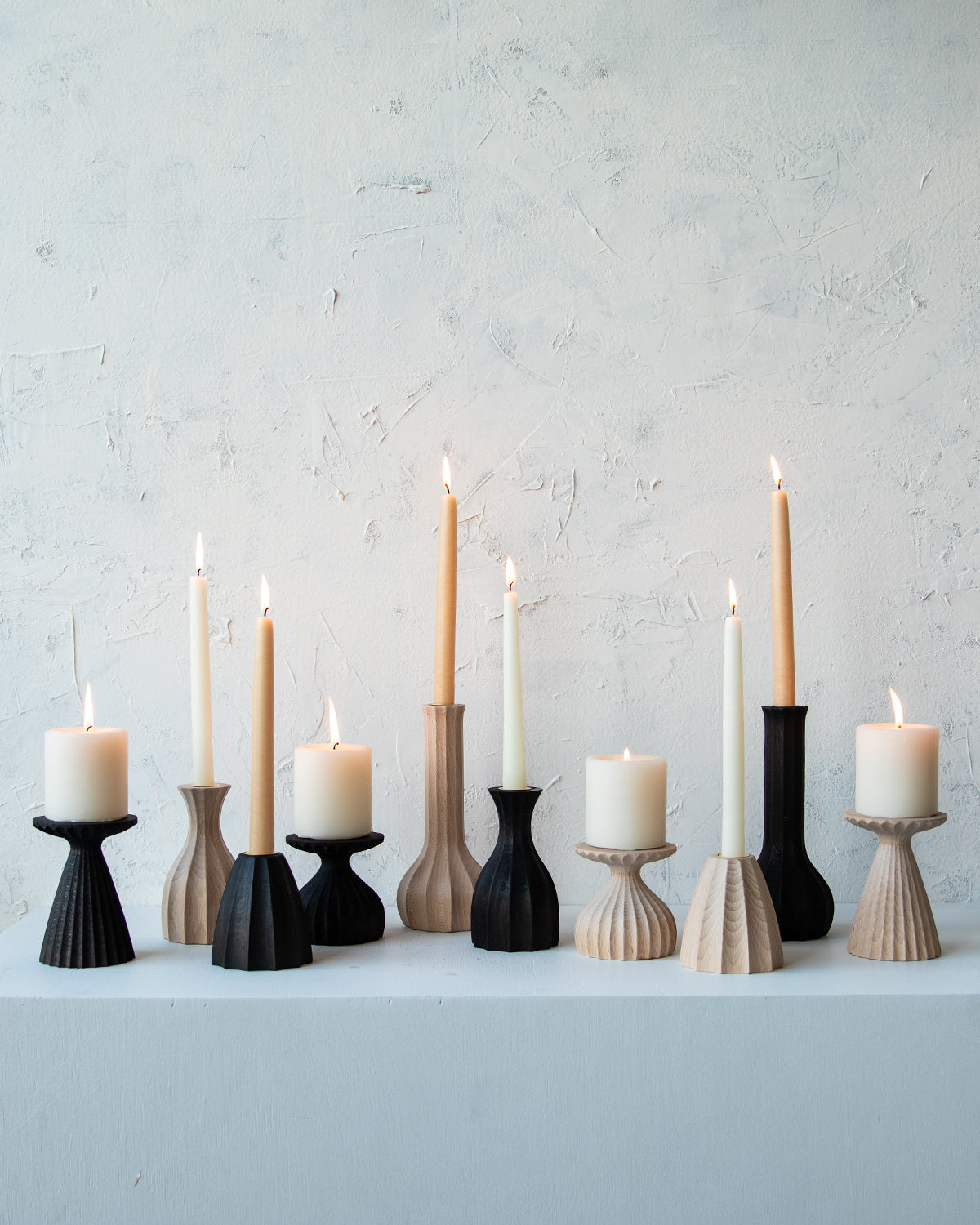 Collection of natural maple and dark wash maple wooden candle holders