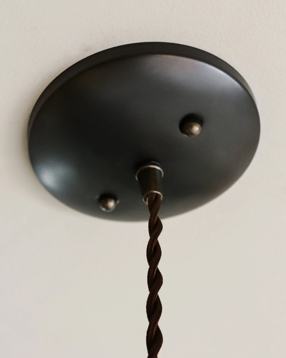 Small Pendant light with clear glass globe and decorative matte black ceramic shade