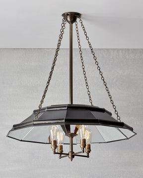 Victorian style metal chandelier with mirrored interior and edison bulbs