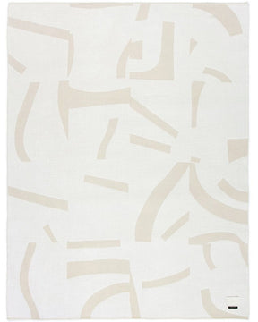 Soft baby alpaca reversible throw with cream and white abstract pattern